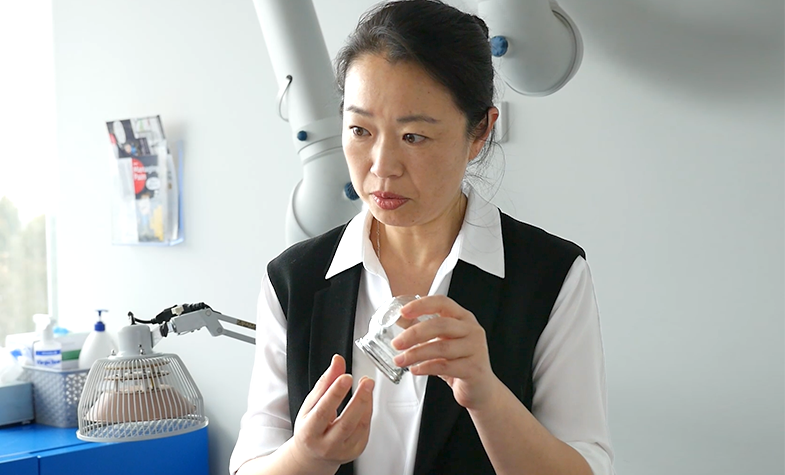Chinese medicine practitioner explaining cupping